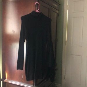 Black sweater dress. Size runs small .